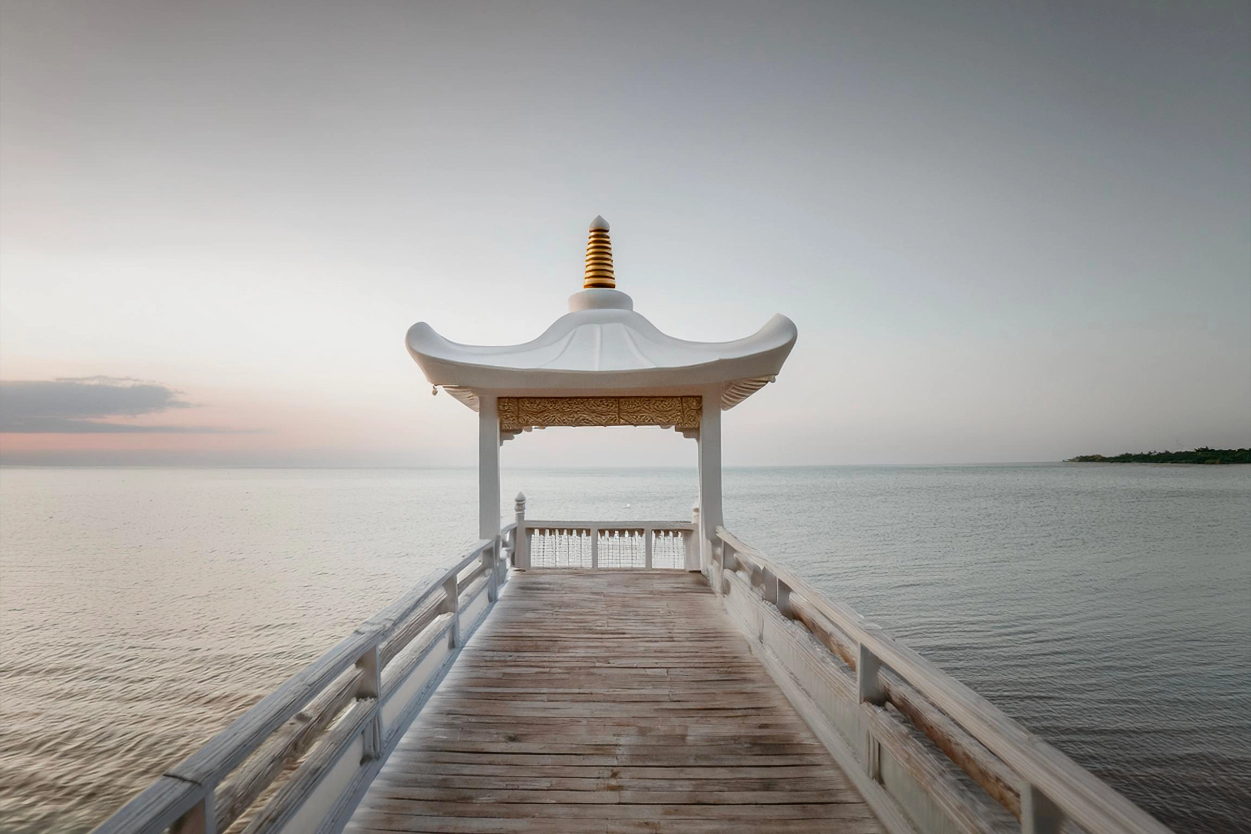 Tantra Serene pavilion overlooking the sea, symbolizing tranquility and the journey through Mother, Father, and Nondual Tantra