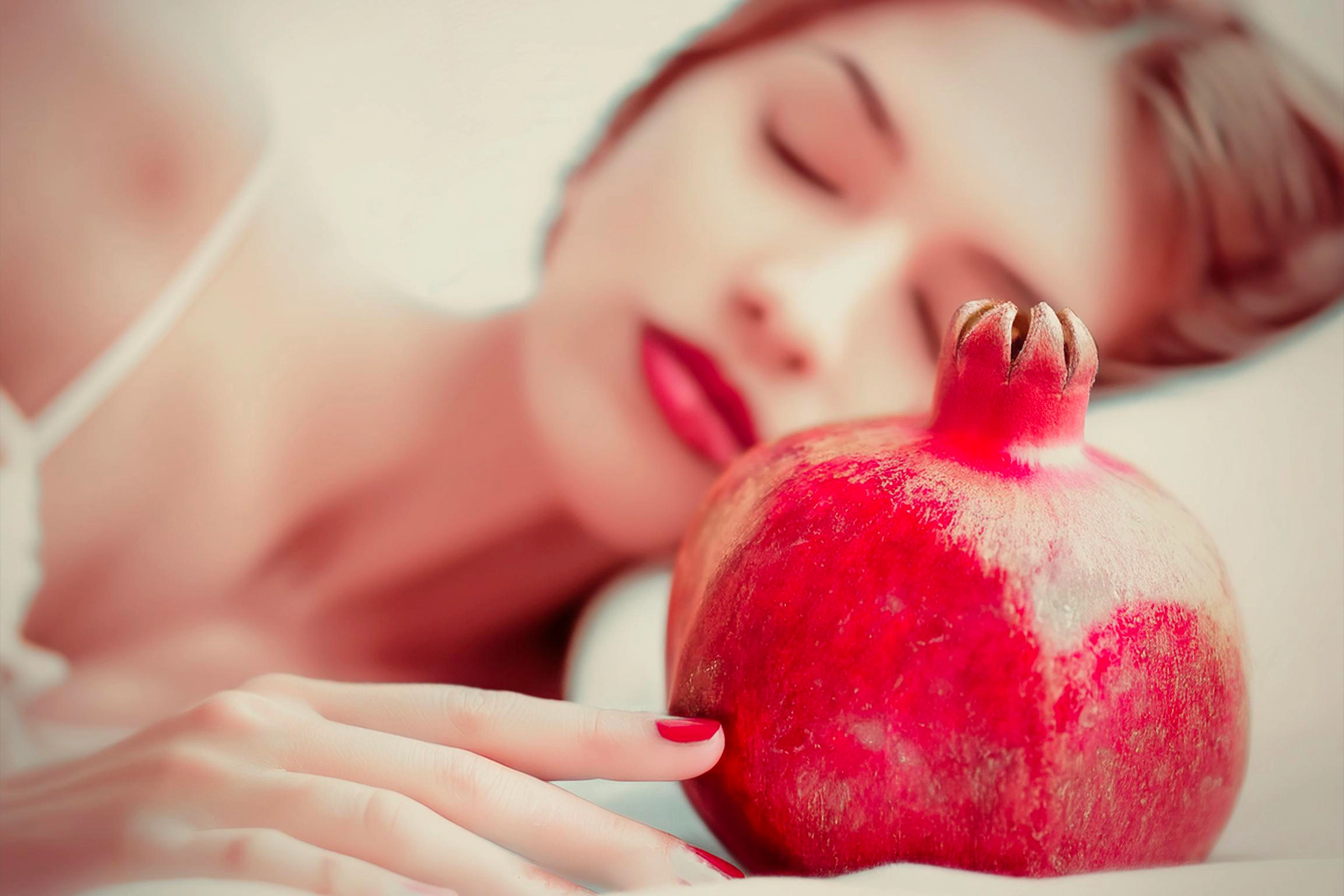 Tantra A beautiful, serene woman sleeping peacefully with a closed pomegranate resting beside her, symbolizing purity and the untapped potential of pleasure and energy