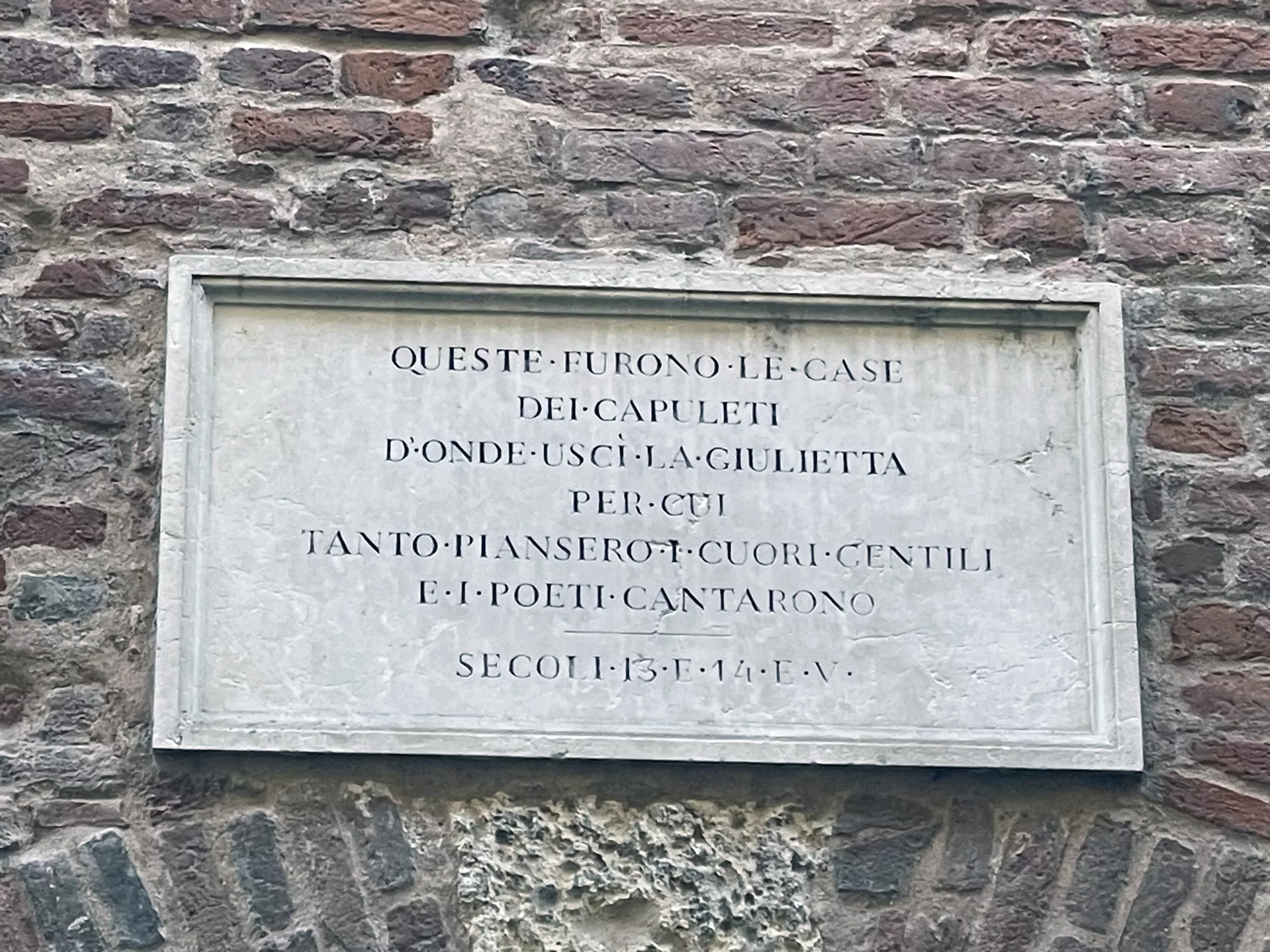The plaque of the Capulet House, symbolizing Juliet’s identity and the cultural roots of her timeless love story.