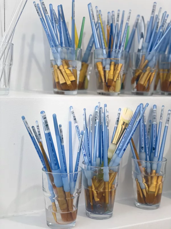 Tantra Artistic paintbrushes laid out for a Tantra Canvas ritual, symbolizing creativity, mindfulness, and the connection between conscious and subconscious