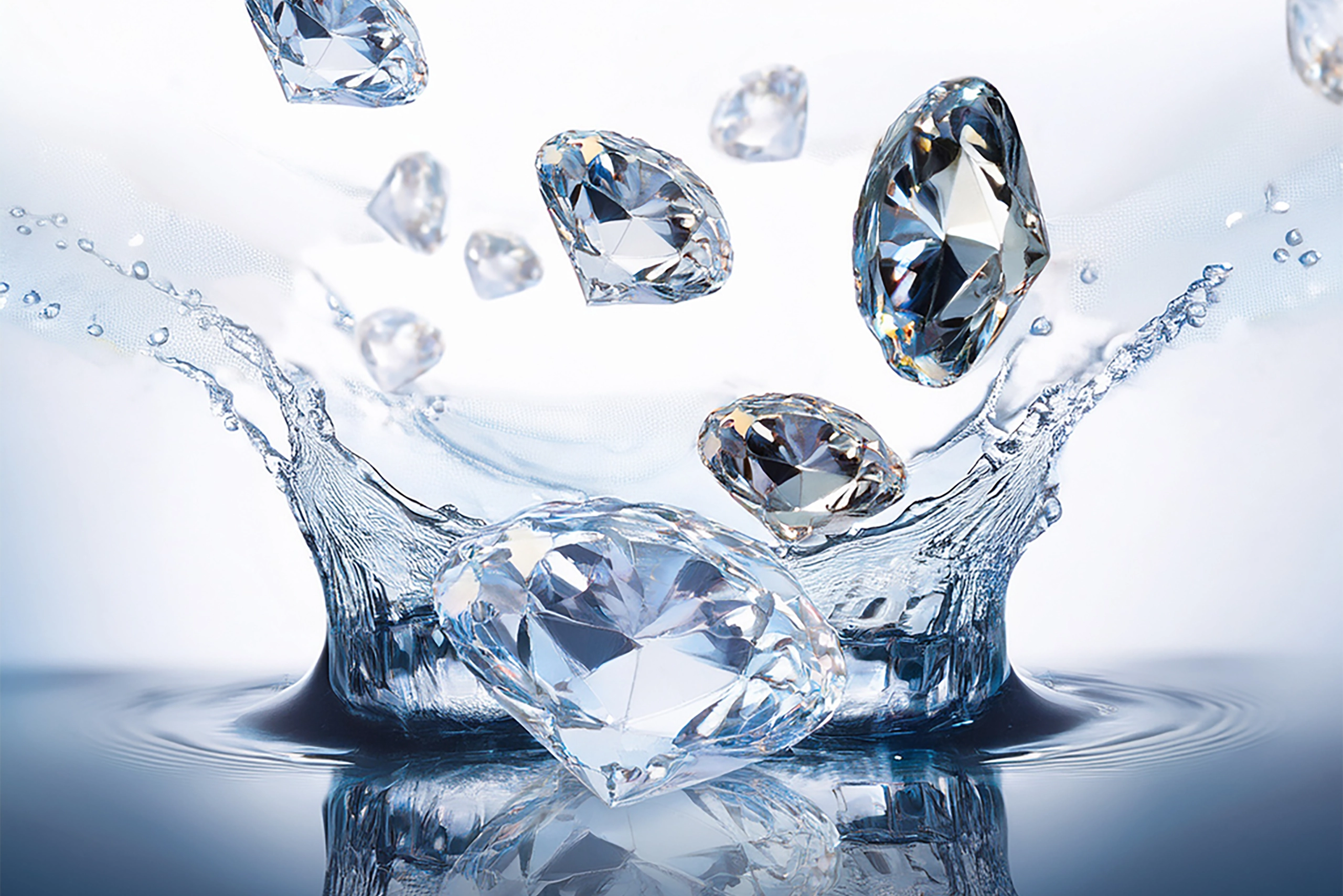 Tantra Diamonds emerging from the water, sparkling and reflecting the light, symbolizing purity and clarity of the mind