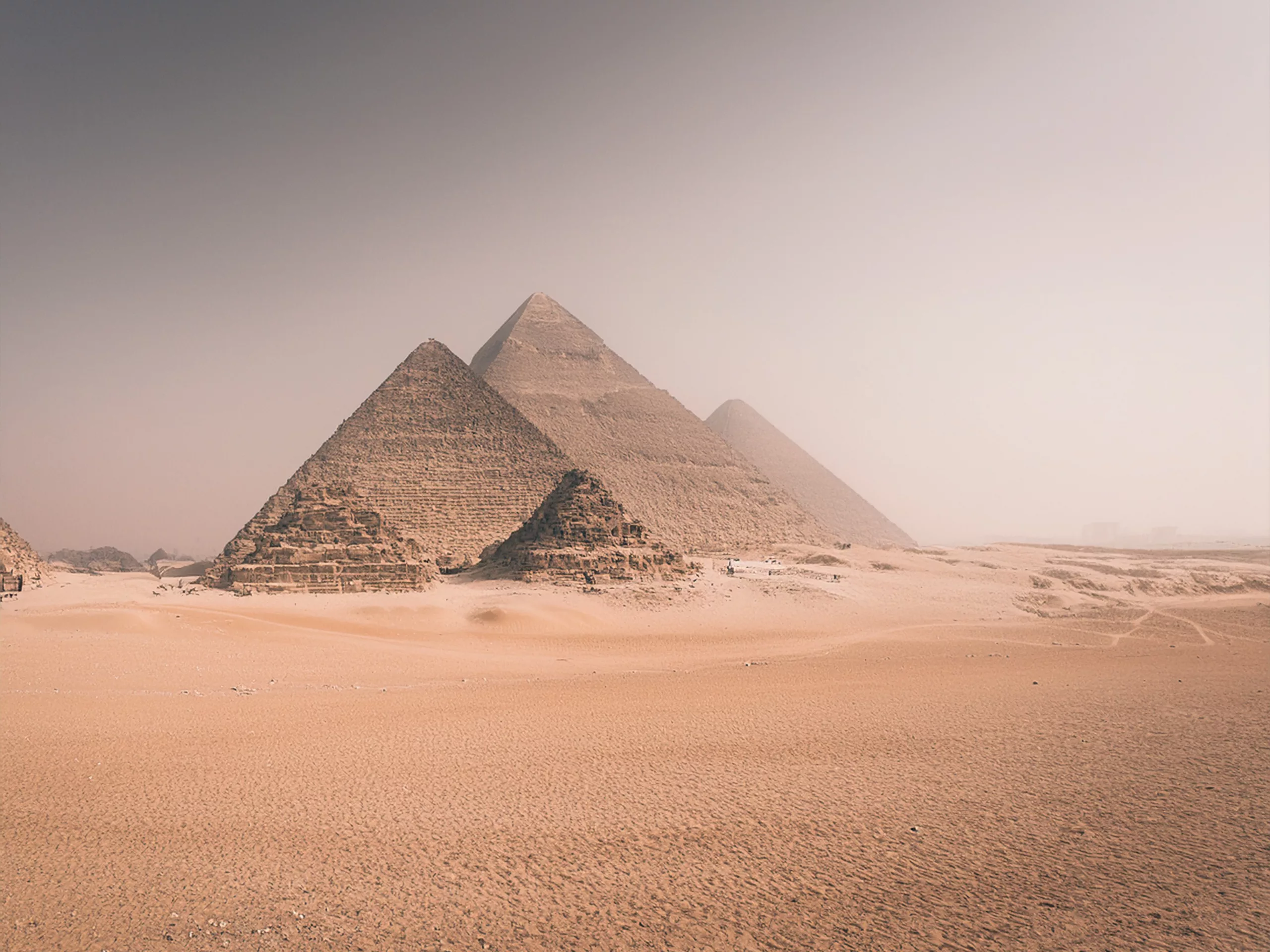 Tantra The majestic pyramids stand beneath a clear sky, timeless symbols of ancient wisdom and cosmic vibrations that still resonate, silent guardians of a deep and secret knowledge at the heart of humanity