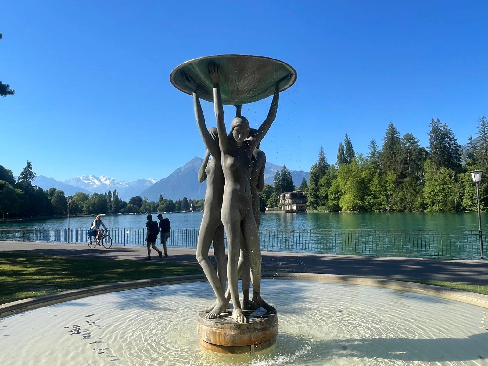A close-up of a human body partially covered in soft natural light, highlighting the texture and curves of the skin, symbolizing the intimate connection between flesh and stone, vulnerability and strength